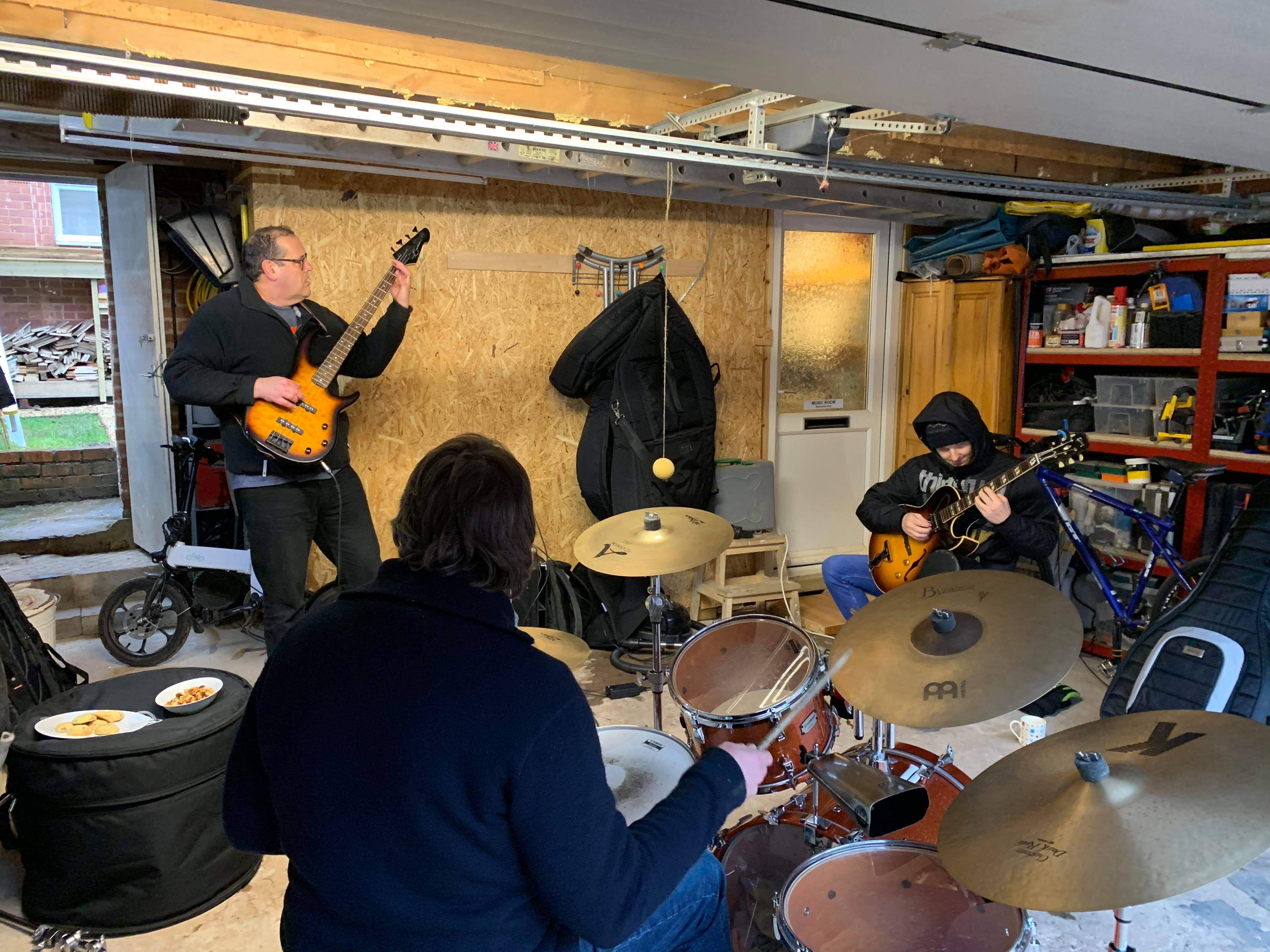Drum, bass, guitar jamming
